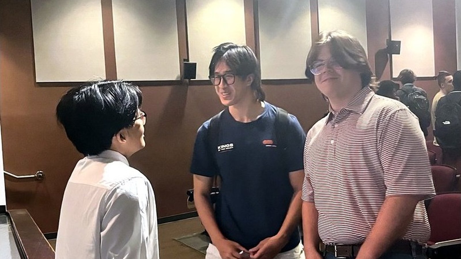 Students talking at GUARD's AI Unfiltered event in Fowlkes Auditorium