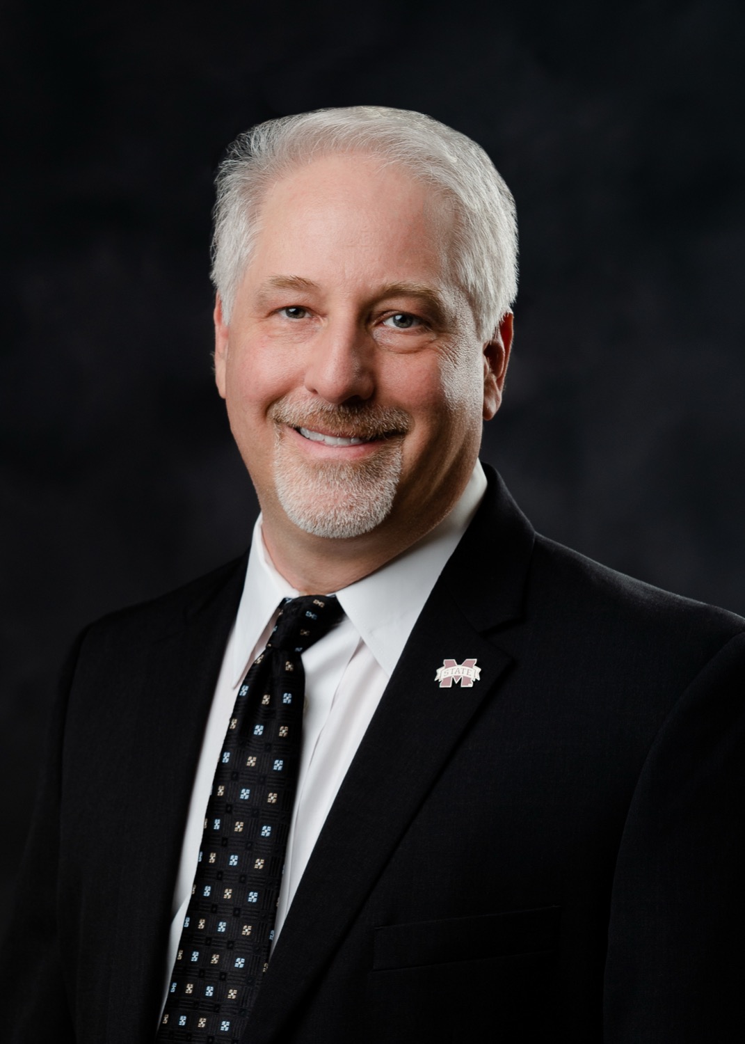 Studio portrait of John Ball, professor at MSU's Center for Advanced Vehicular Systems